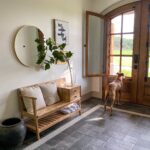 Dog standing in front of beautiful wood door | Millwork