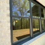 black windows on light colored house