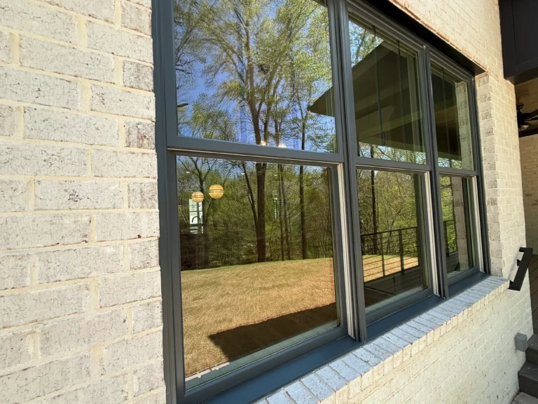 black windows on light colored house
