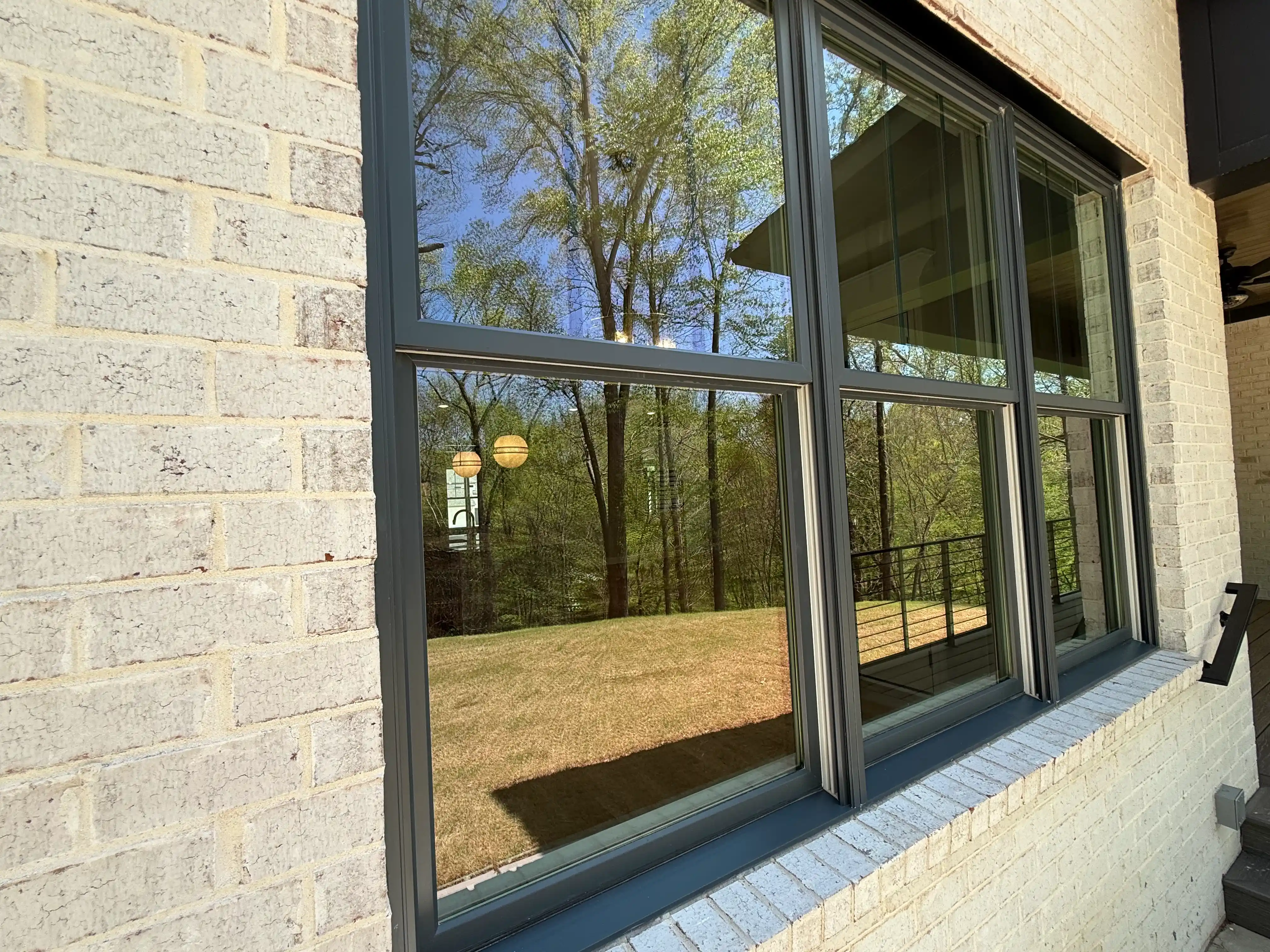 black windows on light colored house